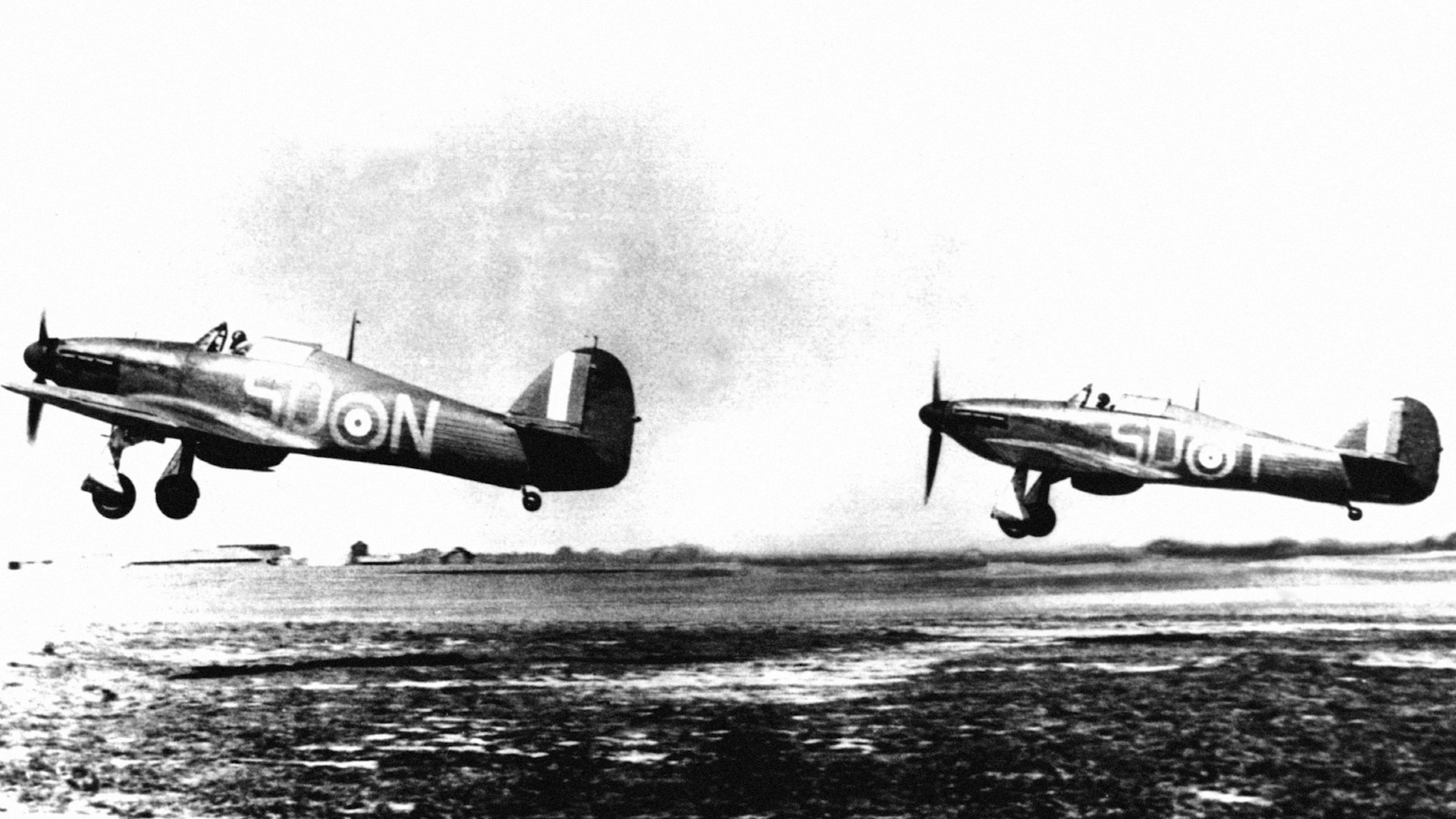 Two RAF Hawker Hurricane MK1 fighters from RAF 79 Squadron taking off from RAF Hawkinge, Kent during the Battle of Britain 200740 CREDIT PA