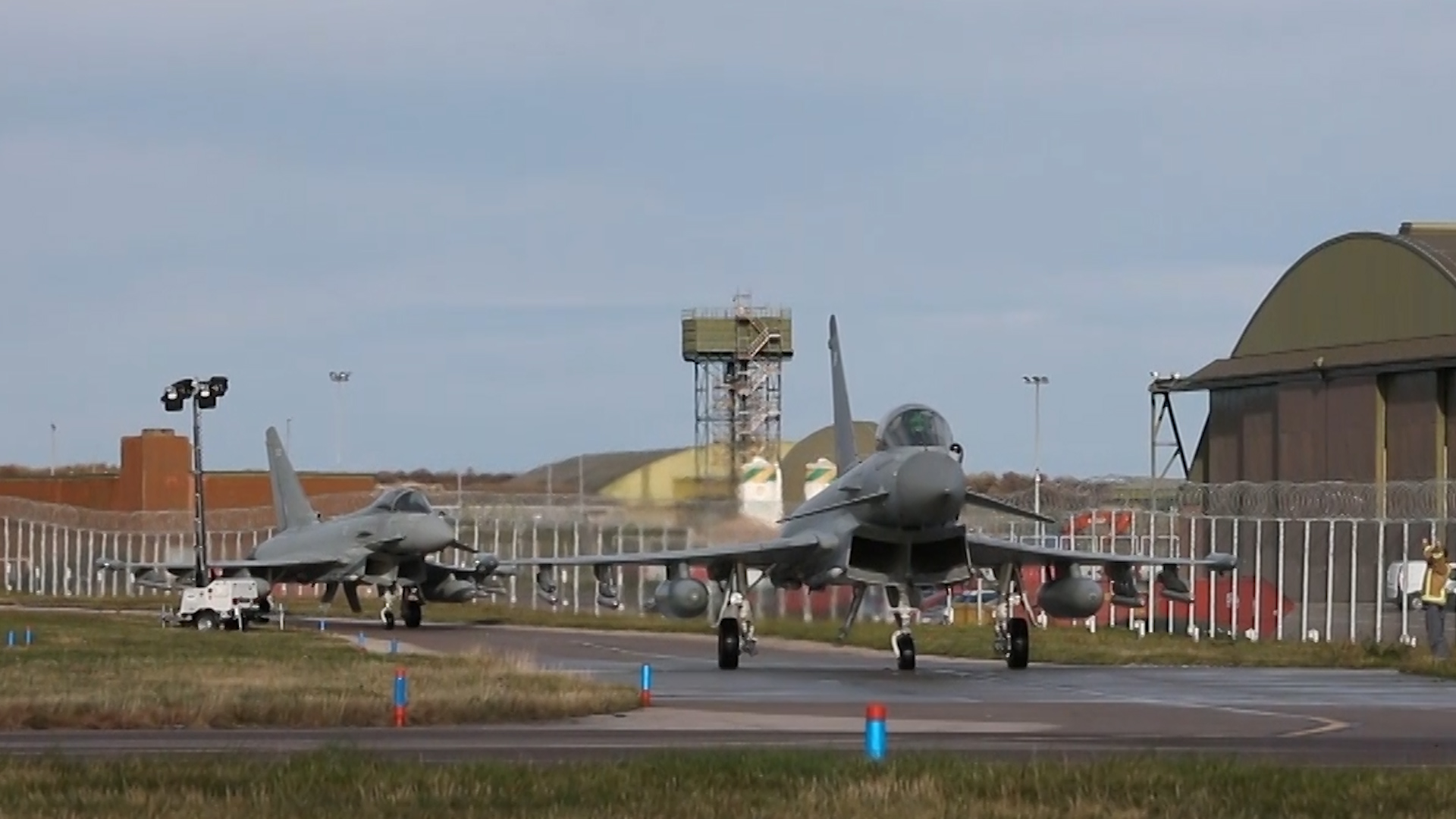 Two RAF Typhoon jets line up on taxiway at RAF Lossiemouth.