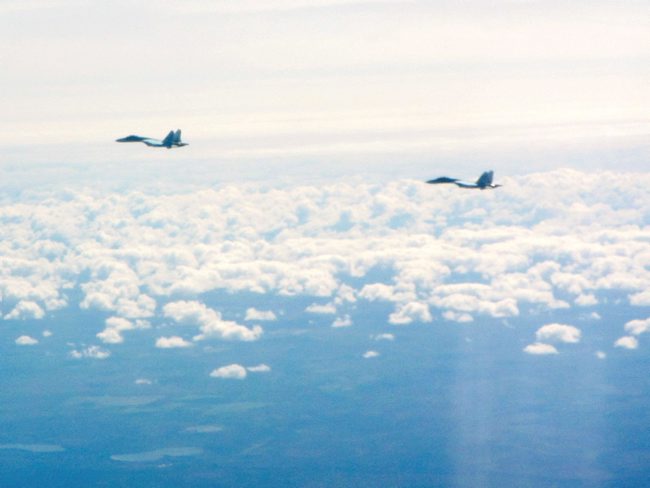 Two Russian SU-27 Flanker aircraft, flying along the Baltic coast