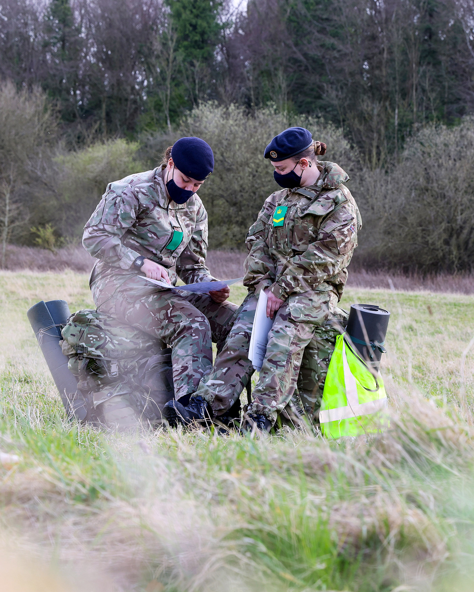 Two female recruits check their position in the middle of a field near Erlestoke (Picture: Royal Navy).