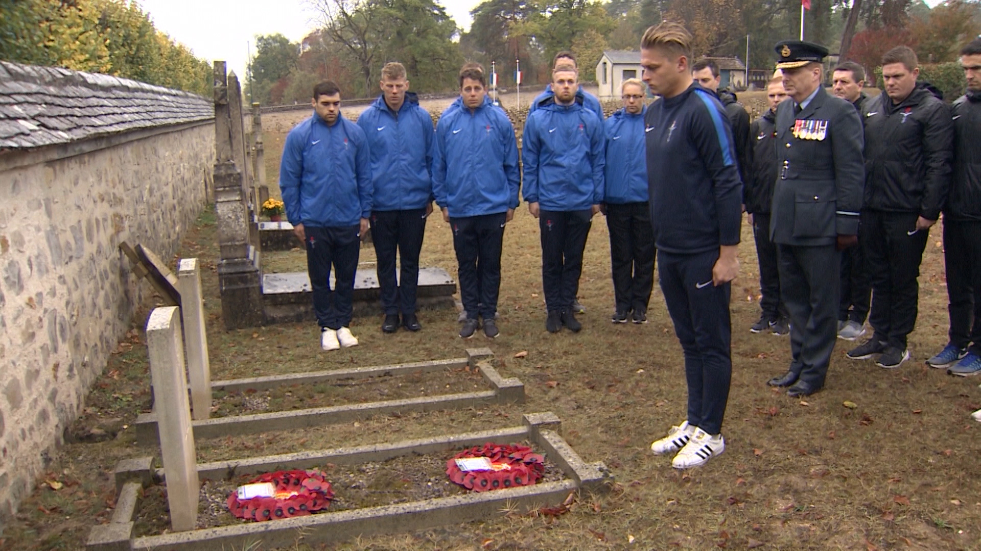 UKAF players lay a poppy wreath