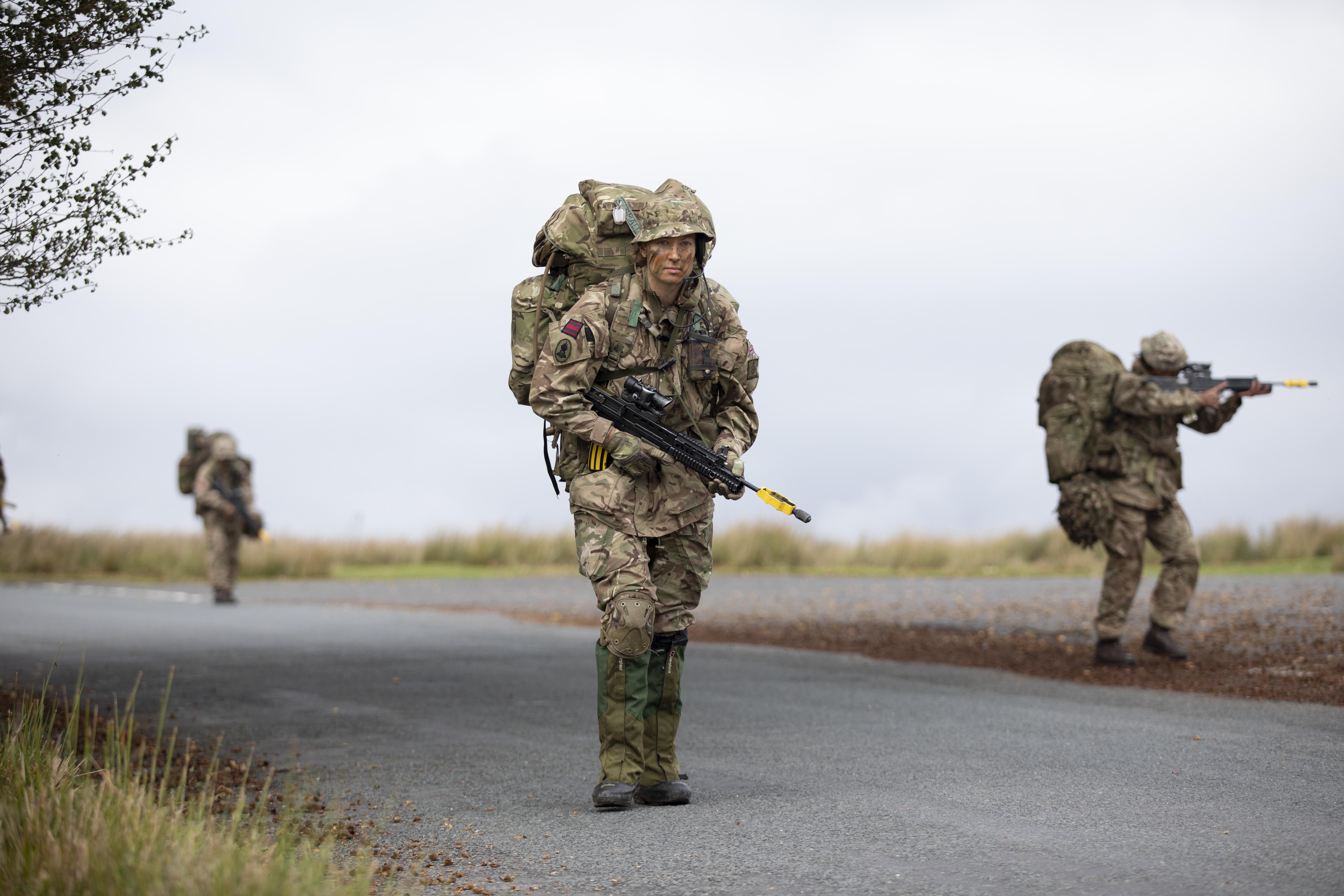 Female team patrol across training area. Credit: Georgina Coupe, BFBS