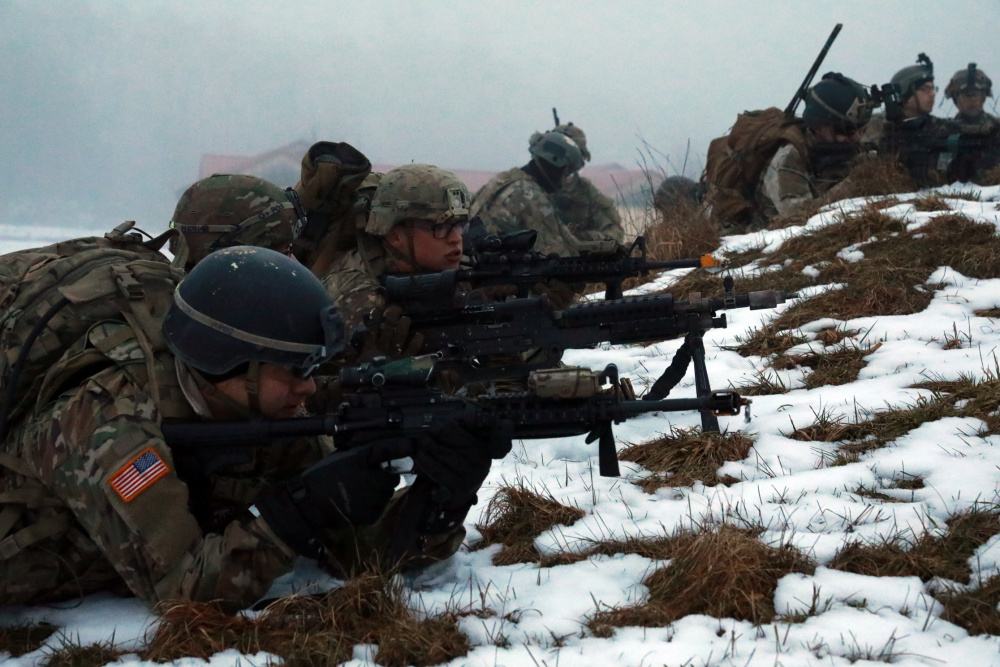 U.S. Army Soldiers assigned to 1st Battalion, 4th Infantry Regiment, return fire at Hohenfels Training Area, Germany