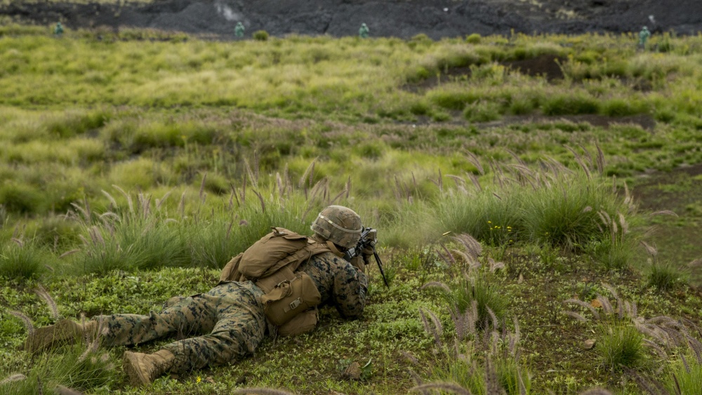US Marine firing an M27 rifle during training exercise