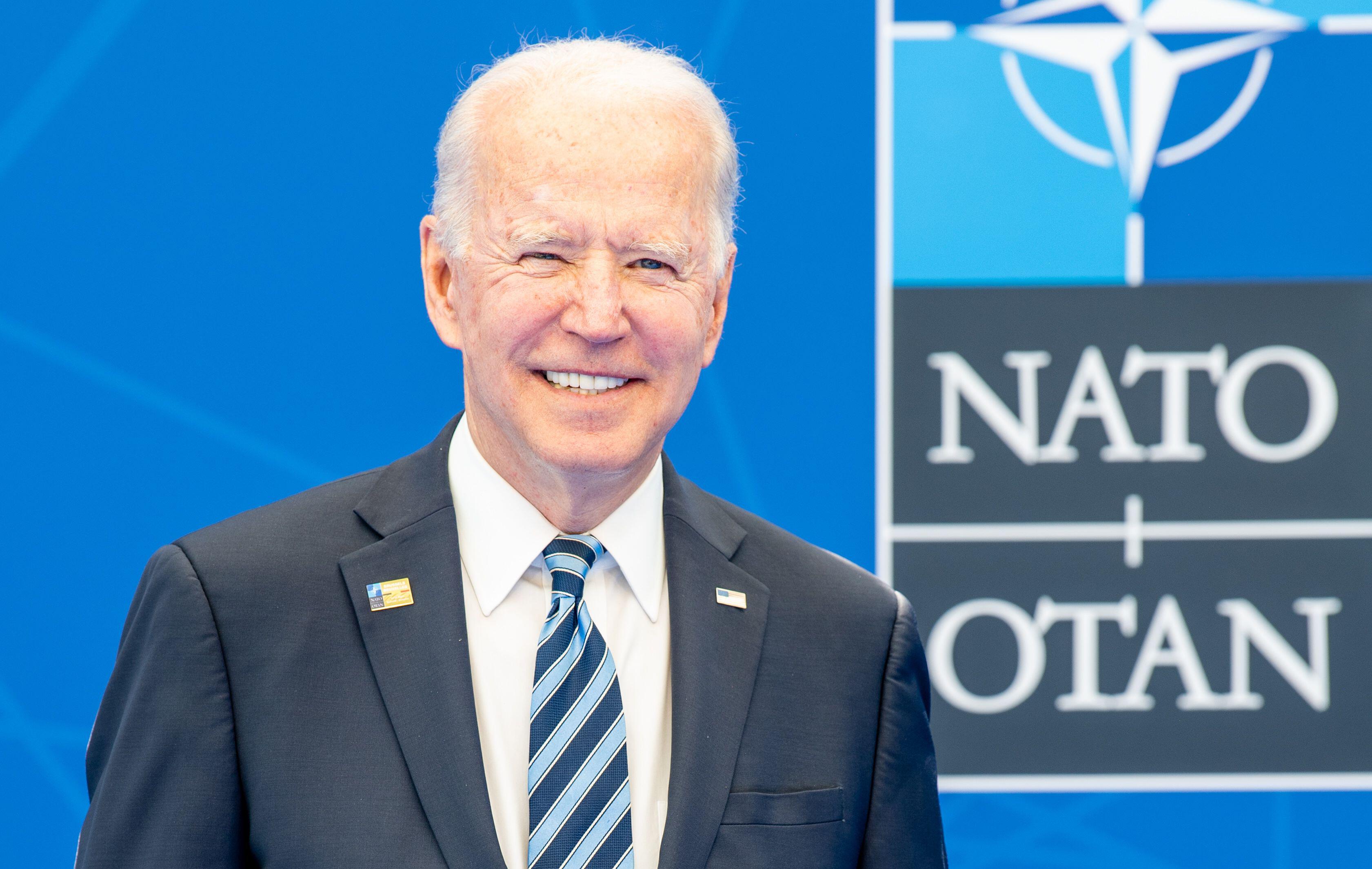 US President Joe Biden during Brussels NATO summit with logo in background 140621 CREDIT SIPA US ALAMY.jpg