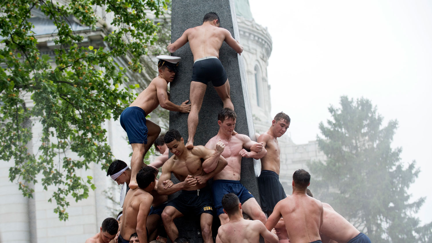 US Naval Academy plebes form a human pyramid around the 21-foot tall Herndon Monument in May 2017 CREDIT US Navy
