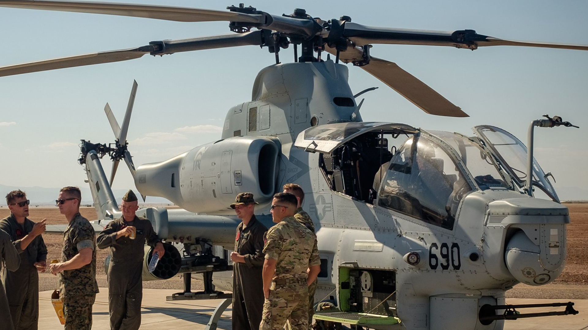 Wildcat crews from 847 NAS chat to their USMC counterparts operating the AH-1Z Viper (Picture: MOD)