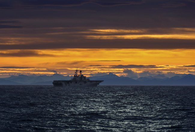 The USS Iwo Jima seen at sunset