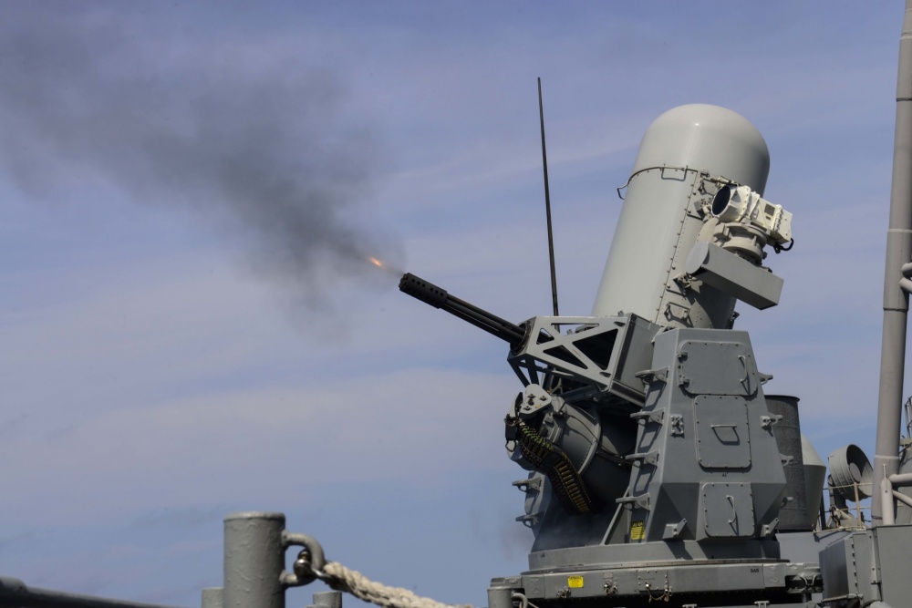 USS Normandy firing its Phalanx weapons system