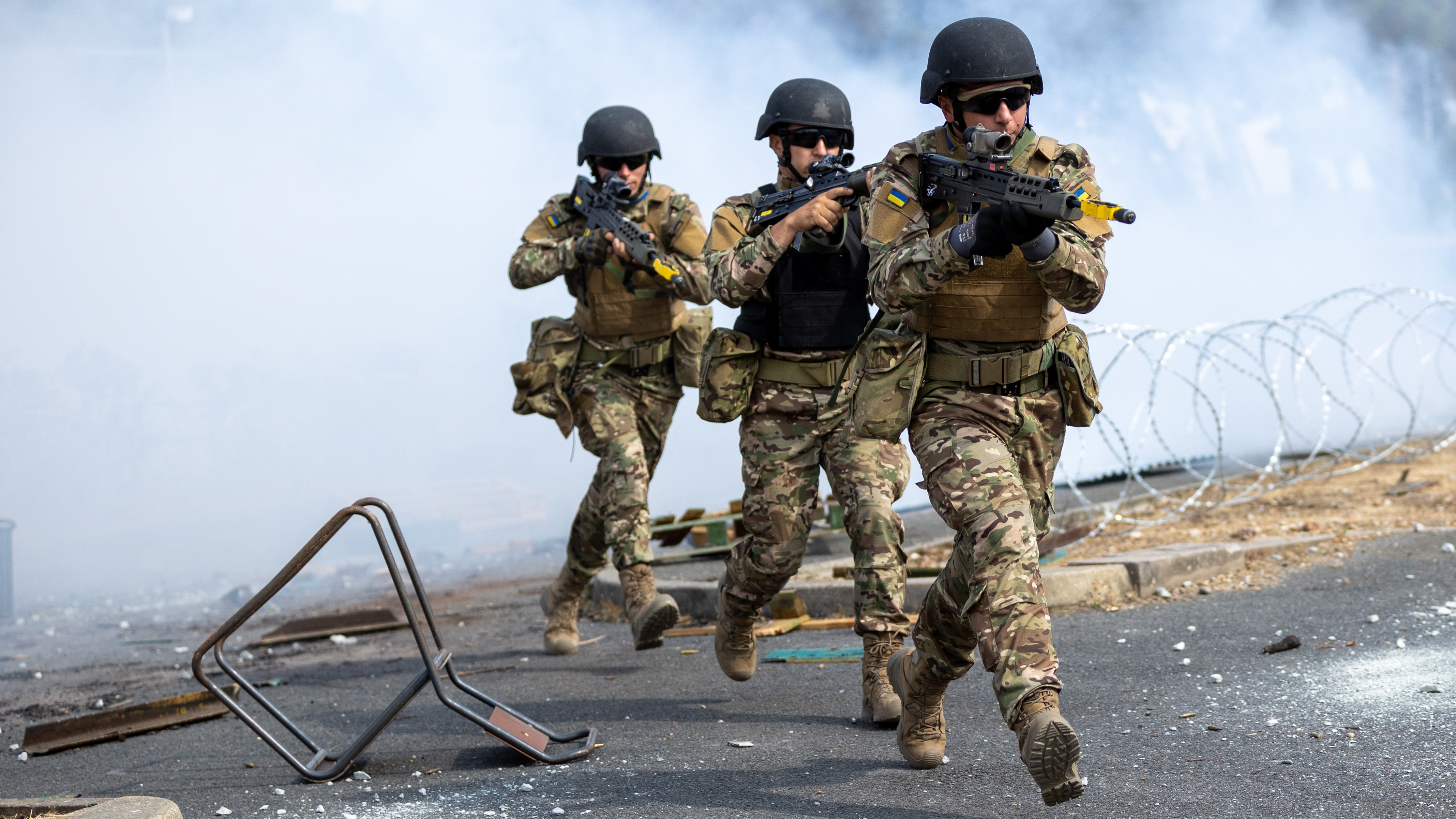 Ukrainian trainees practising urban fighting techniques during UK training programme