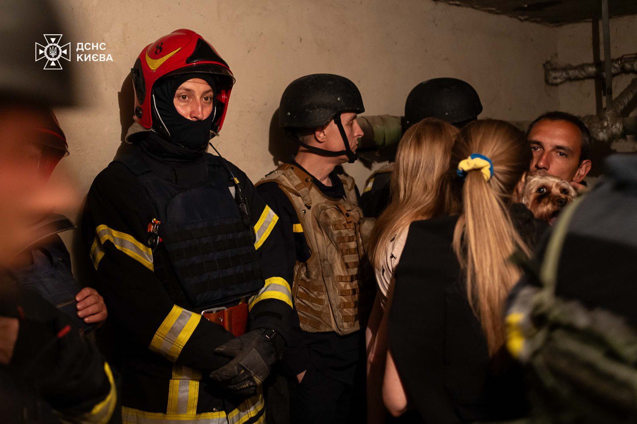 Ukrainians hiding in sheler during air raid