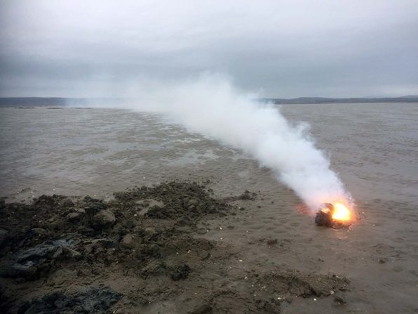 Unexploded munition on fire in the Gower Peninsula (Picture: Royal Navy).