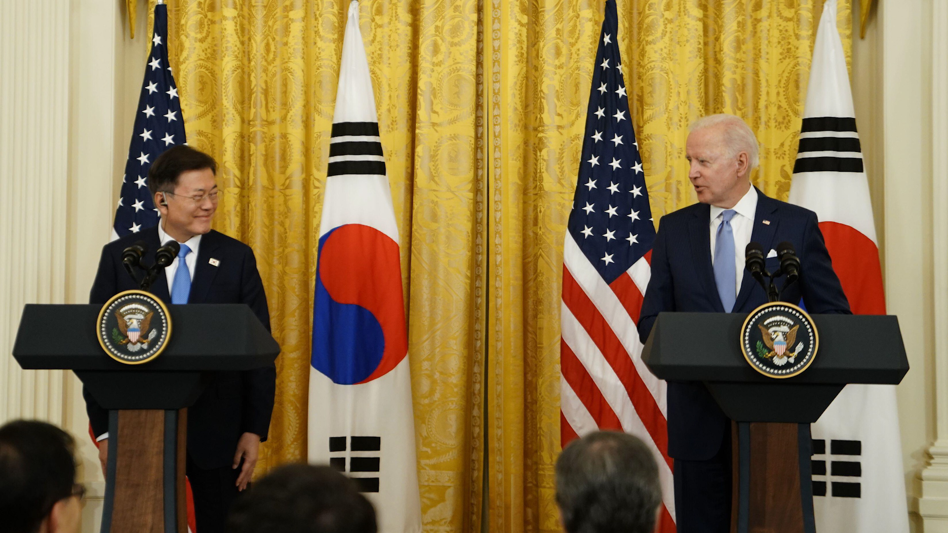 United States President Joe Biden, right, speaks as President Moon Jae-in of South Korea, listens during a news conference in the East Room of the White House in Washington, DC 210521 CREDIT Newscom Alamy.jpg