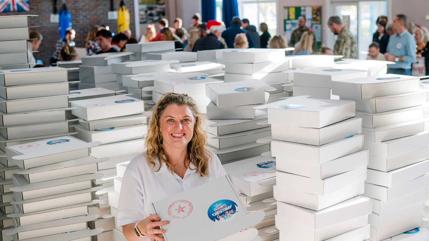 Veteran and founder of Little Troopers Louise Fetigan packs 2,500 Christmas Smiles boxes CREDIT Deborah Johnson