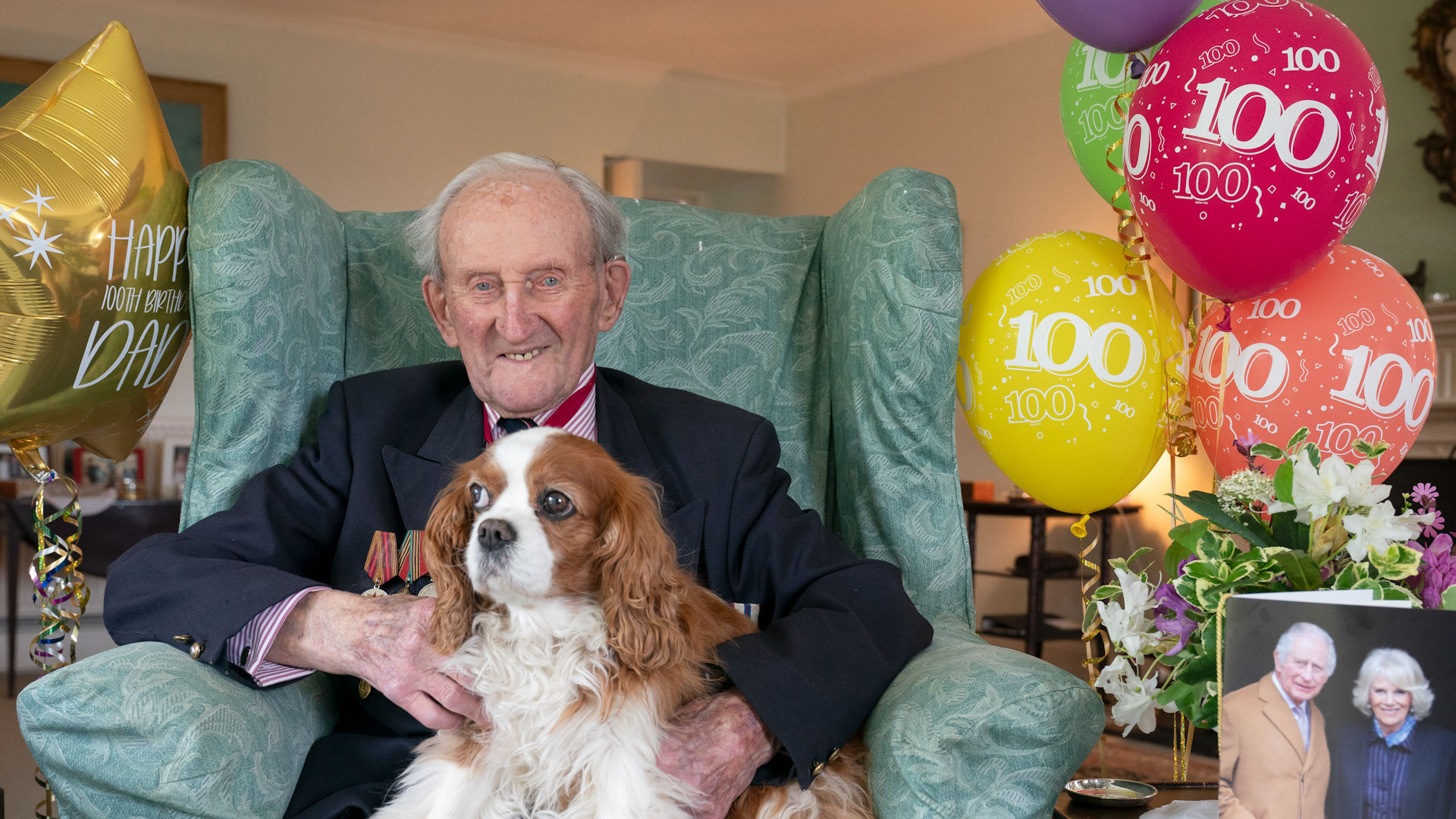 Vice Admiral Sir Thomas Baird, from Symington in Ayrshire, celebrating his 100th birthday with his dog Victoria