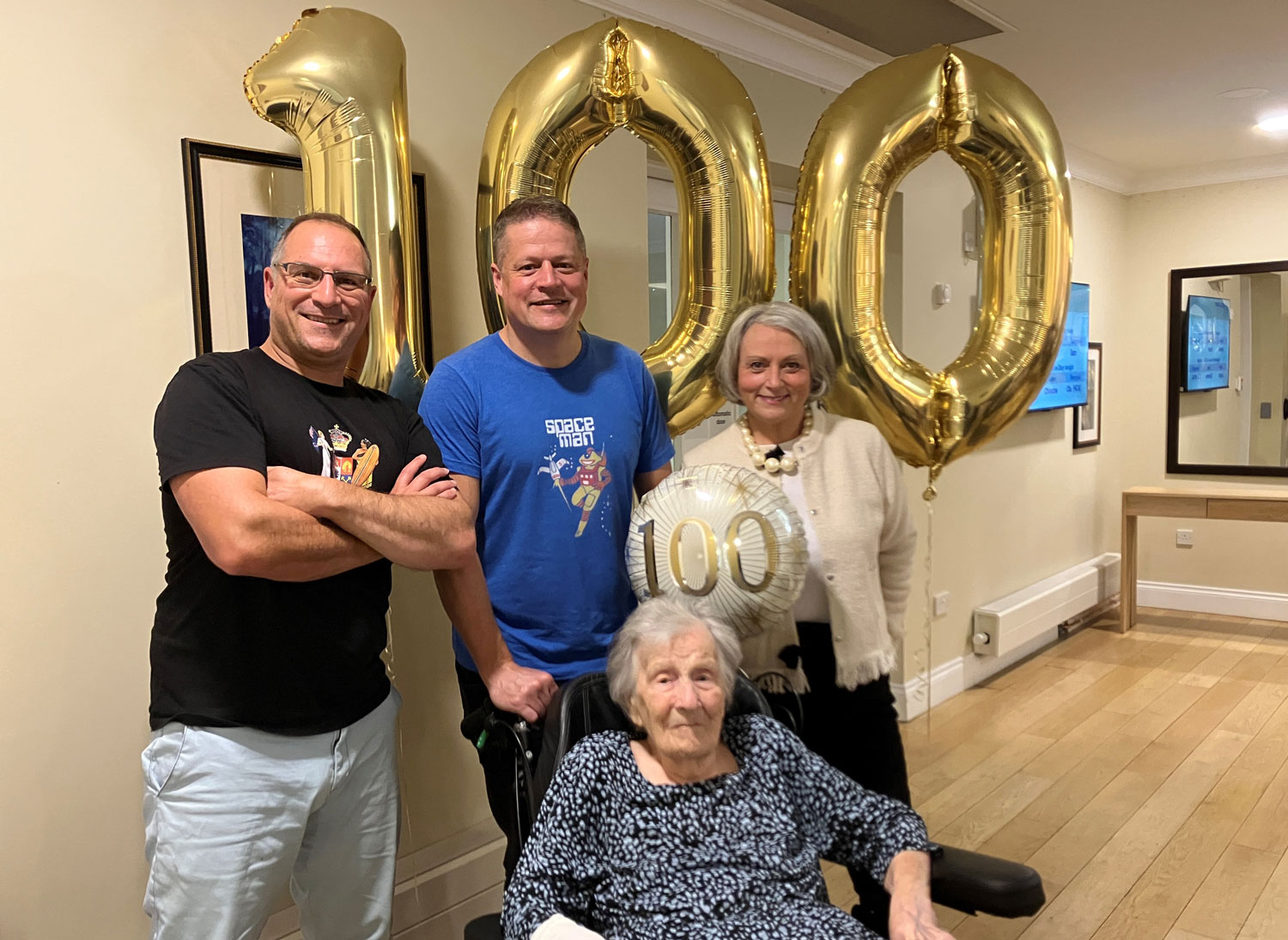 WAAF veteran Mrs Amy Wein pictured with her grandsons Daniel and Richard and daughter Kim at her 100th birthday party CREDIT Royal Star & Garter
