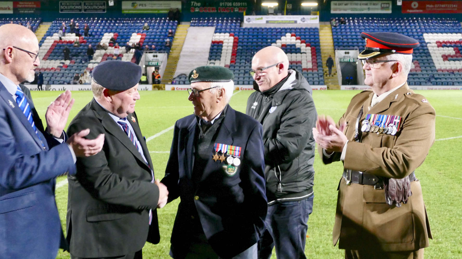 The surprise presentation was made at half-time between Rochdale AFC's home League Two game versus Stevenage