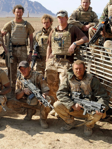 Warrant Officer Hunt (front right) with Prince Harry (back centre) and Dean Smith (back left) in Afghanistan (Picture: PA).