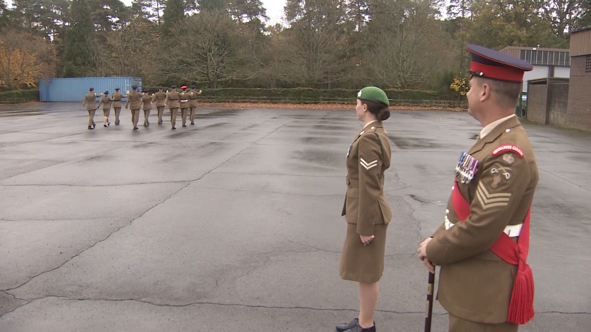 Watching on as personnel take part in a drill course at Pirbright.