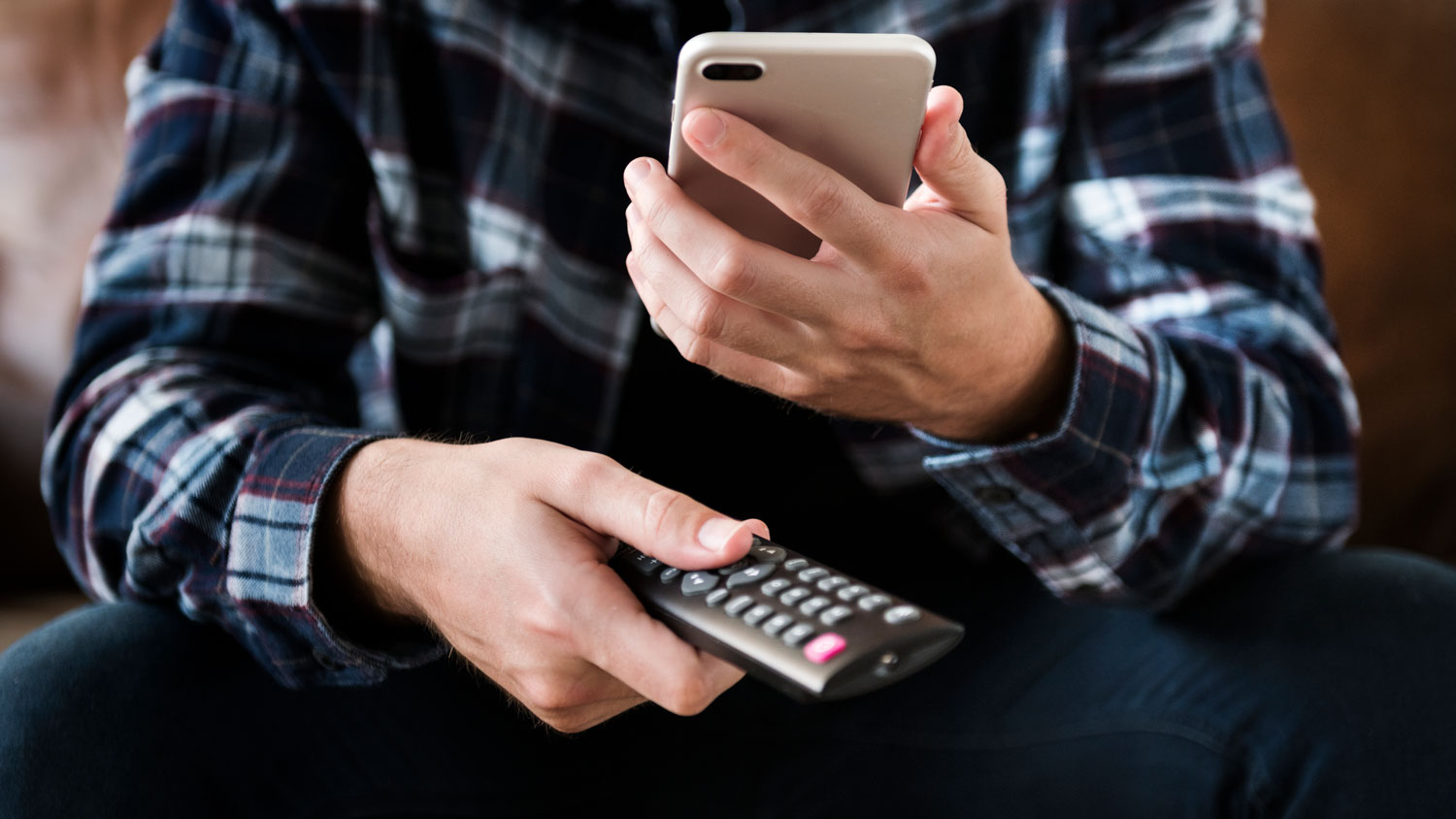 Watching TV Streaming Mobile Remote Control Credit: www.rawpixel.com