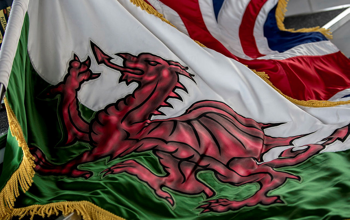 Welsh flag alongside a Union Jack at a Service of Remembrance marking the 35th anniversary of the end of The Falklands War
