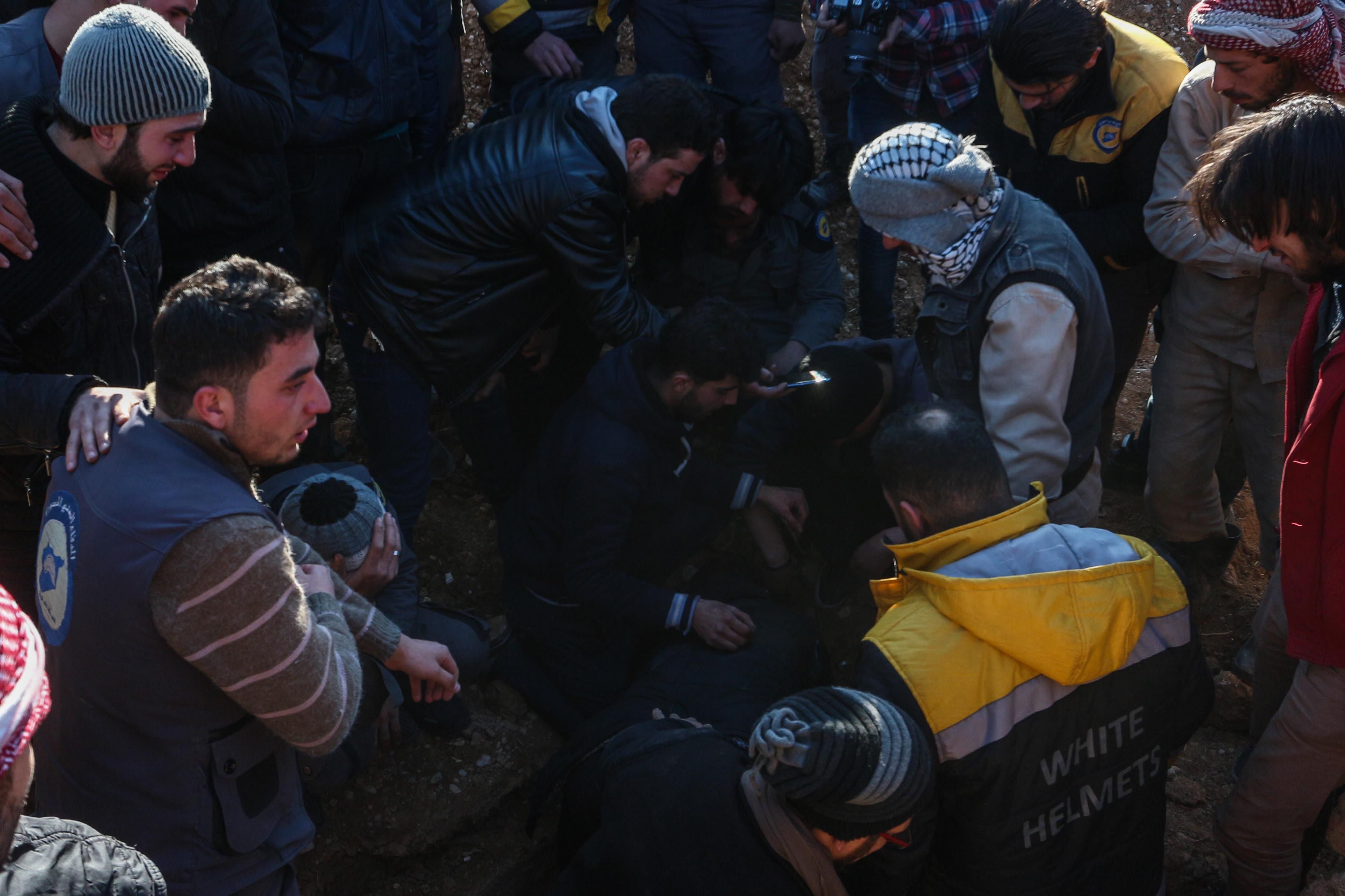 Syrian White Helmet helps shelling victims in Douma 