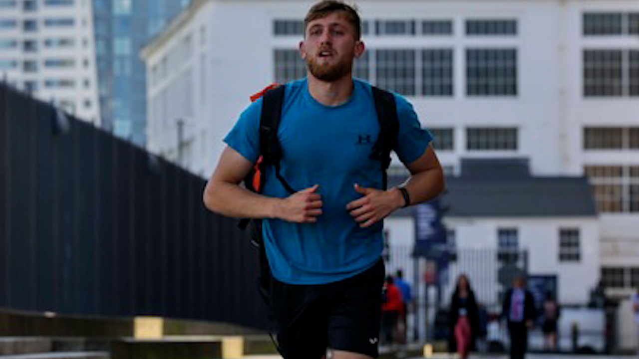 Will Matthews arriving in Portsmouth after running 414 miles over 13 days across the UK (Picture: Royal Navy)