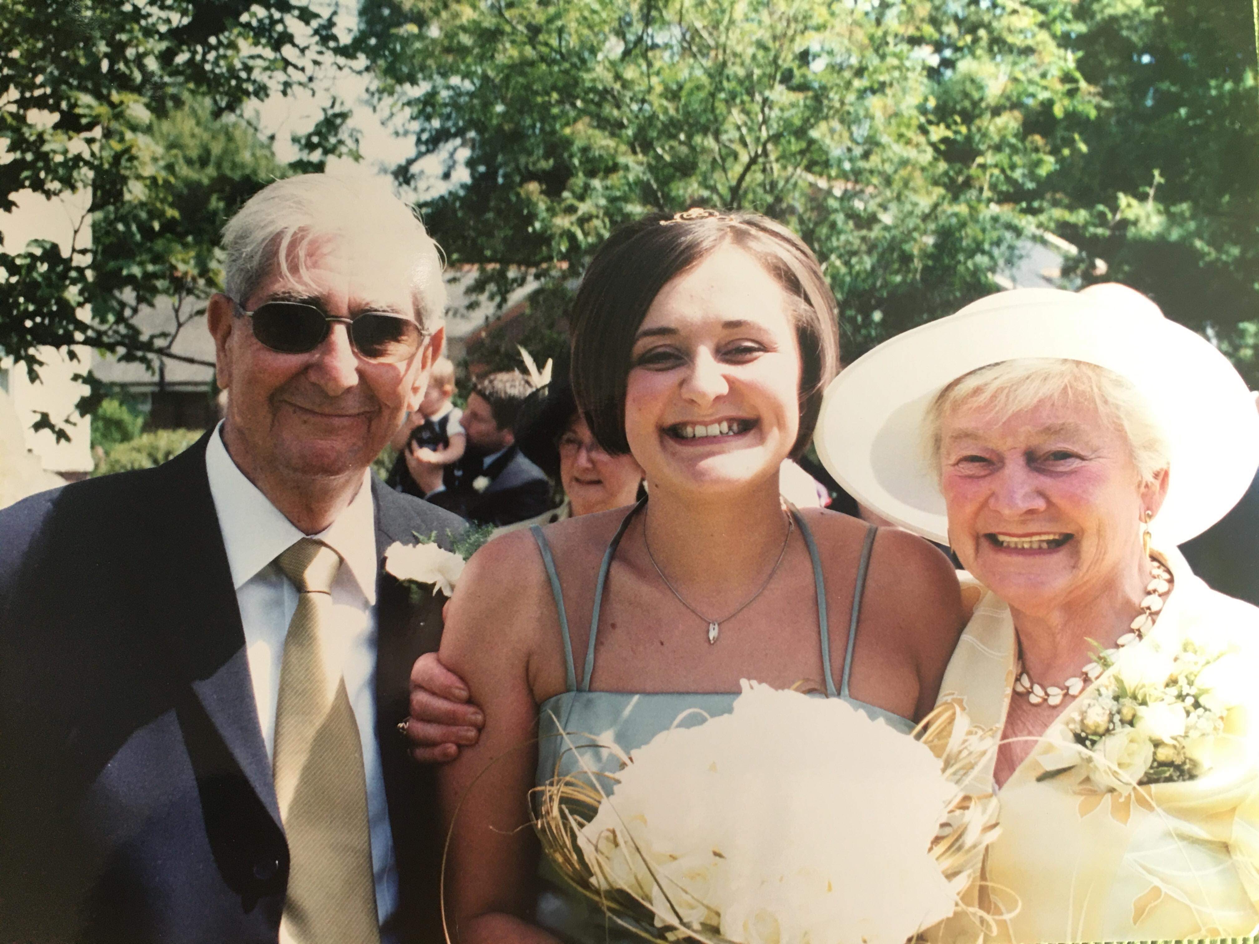 Wing Commander Foy alongside her grandparents (Picture: Courtesy of John Sutton's family).
