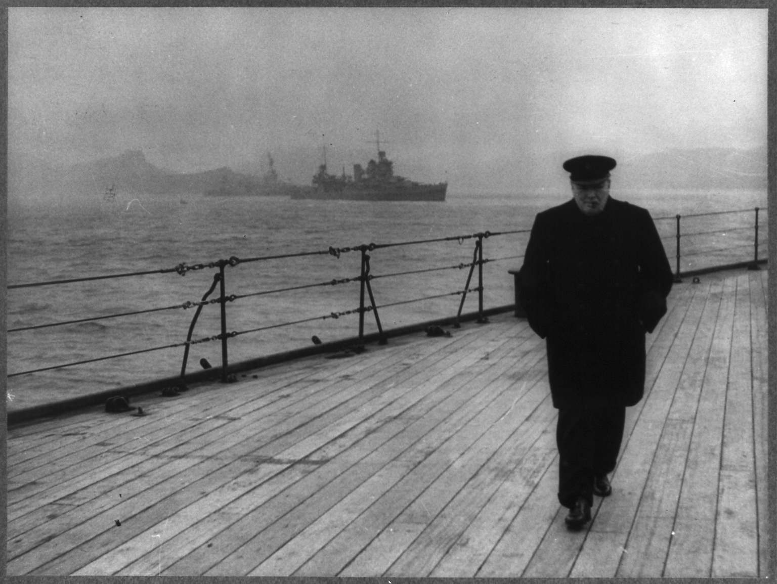 Prime Minister Winston Churchill, walking the deck of HMS Prince of Wales during the Atlantic Conference, 1941