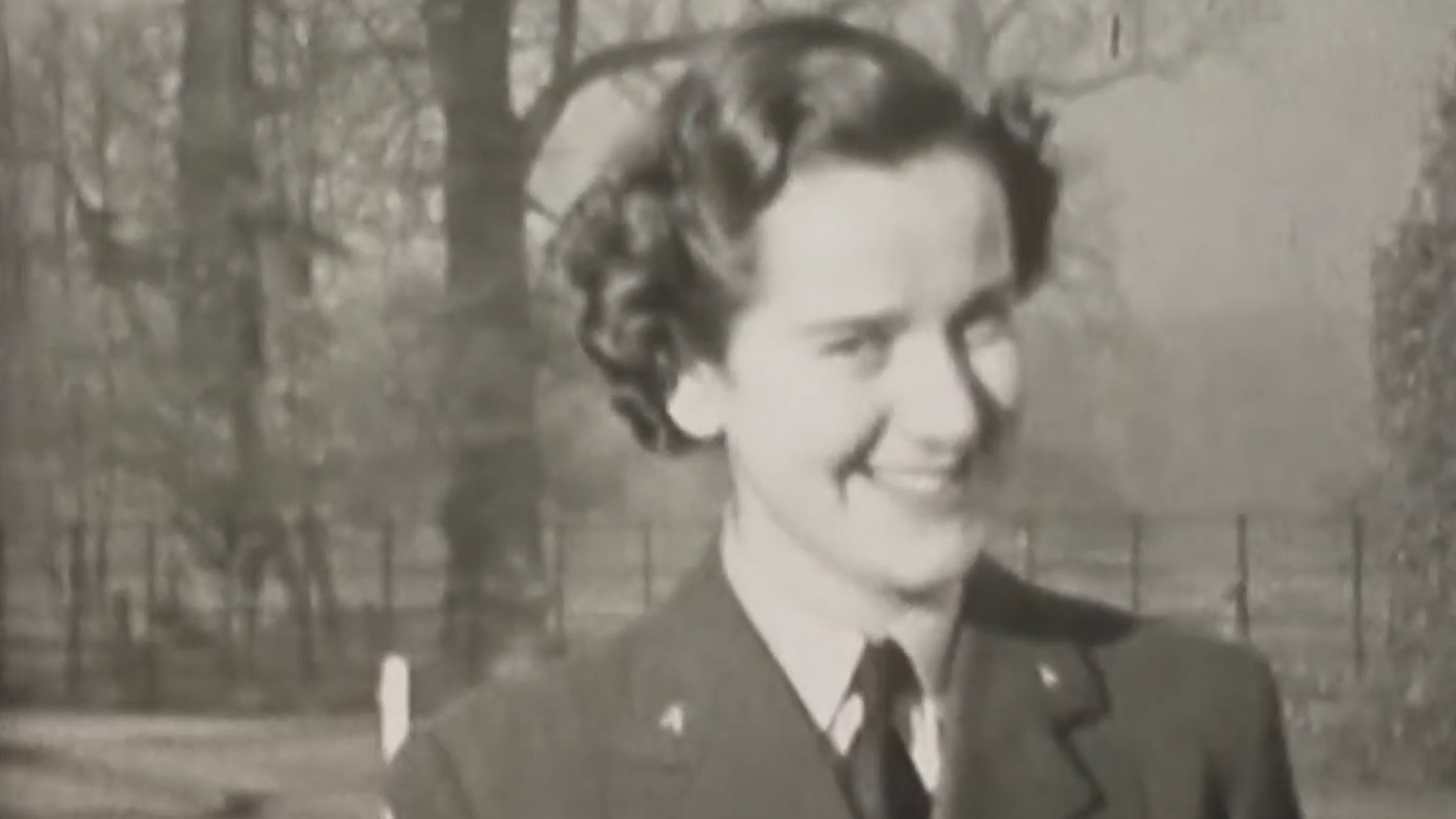 Woman smiling to the camera WWII MI6 Whaddon Hall footage 030420 CREDIT Bletchley Park YouTube.jpg 