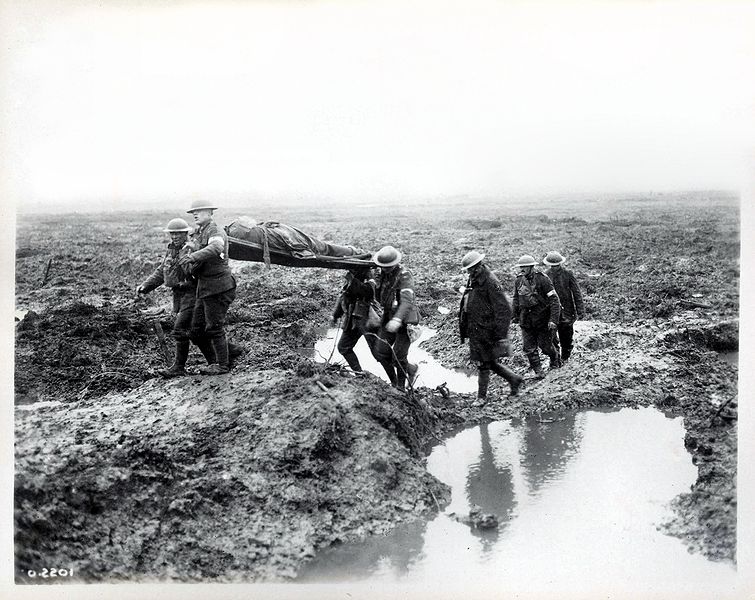 A wounded Canadian soldier being taken to an aid post (image: William Rider-Rider and Library and Archives Canada)