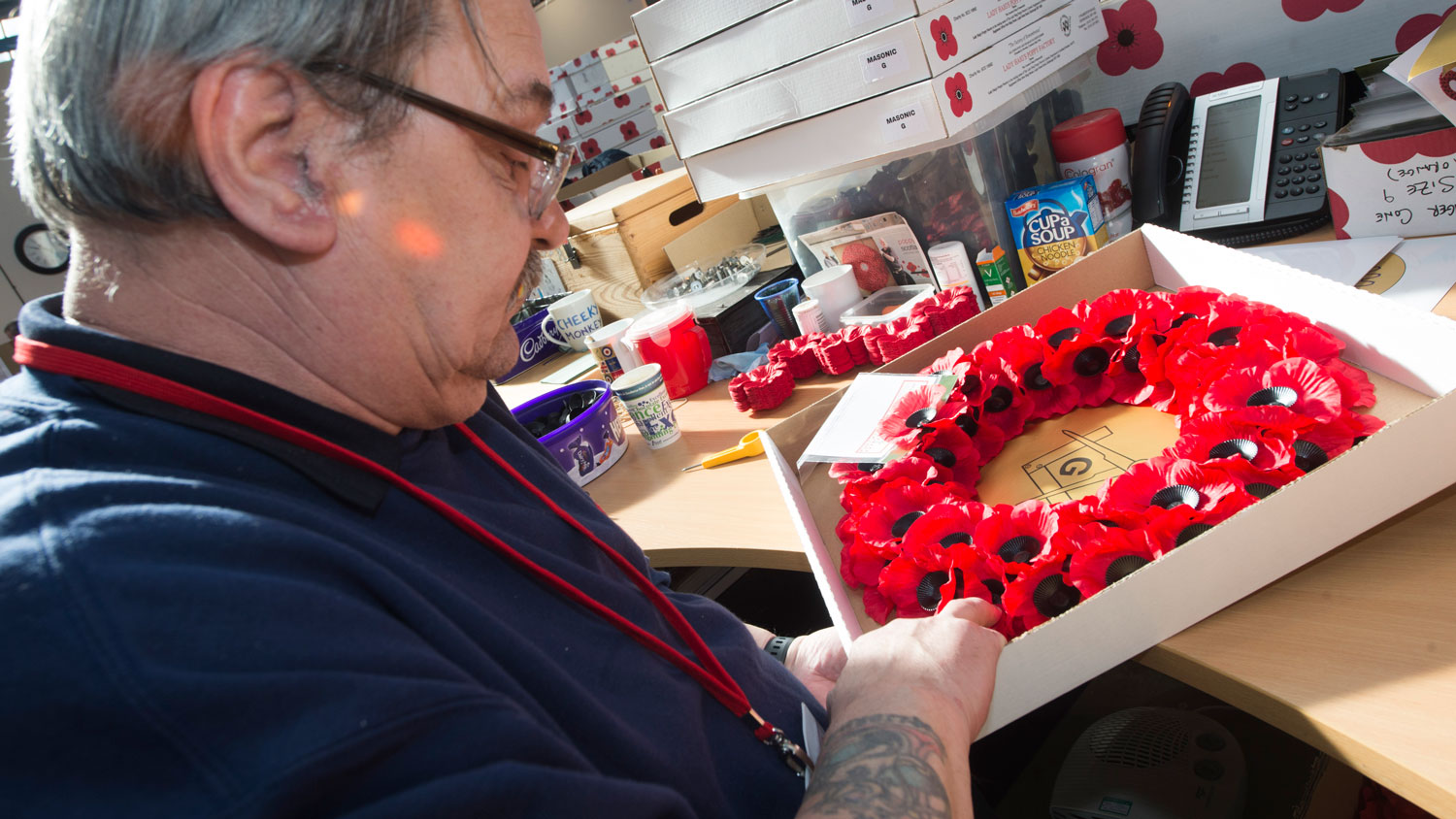 A veteran makes a Scottish poppy wreath at Lady Haig's Poppy Factory (Picture Poppyscotland)