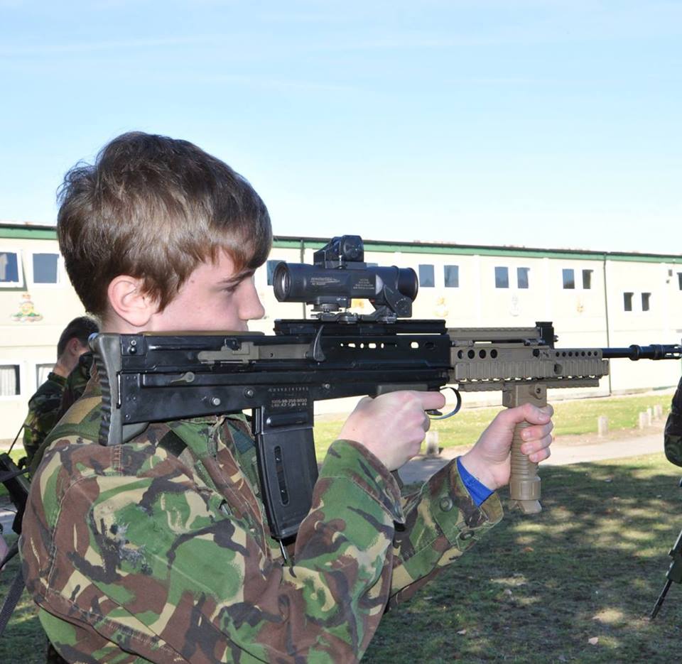 Potential recruit takes aim with a replica rifle