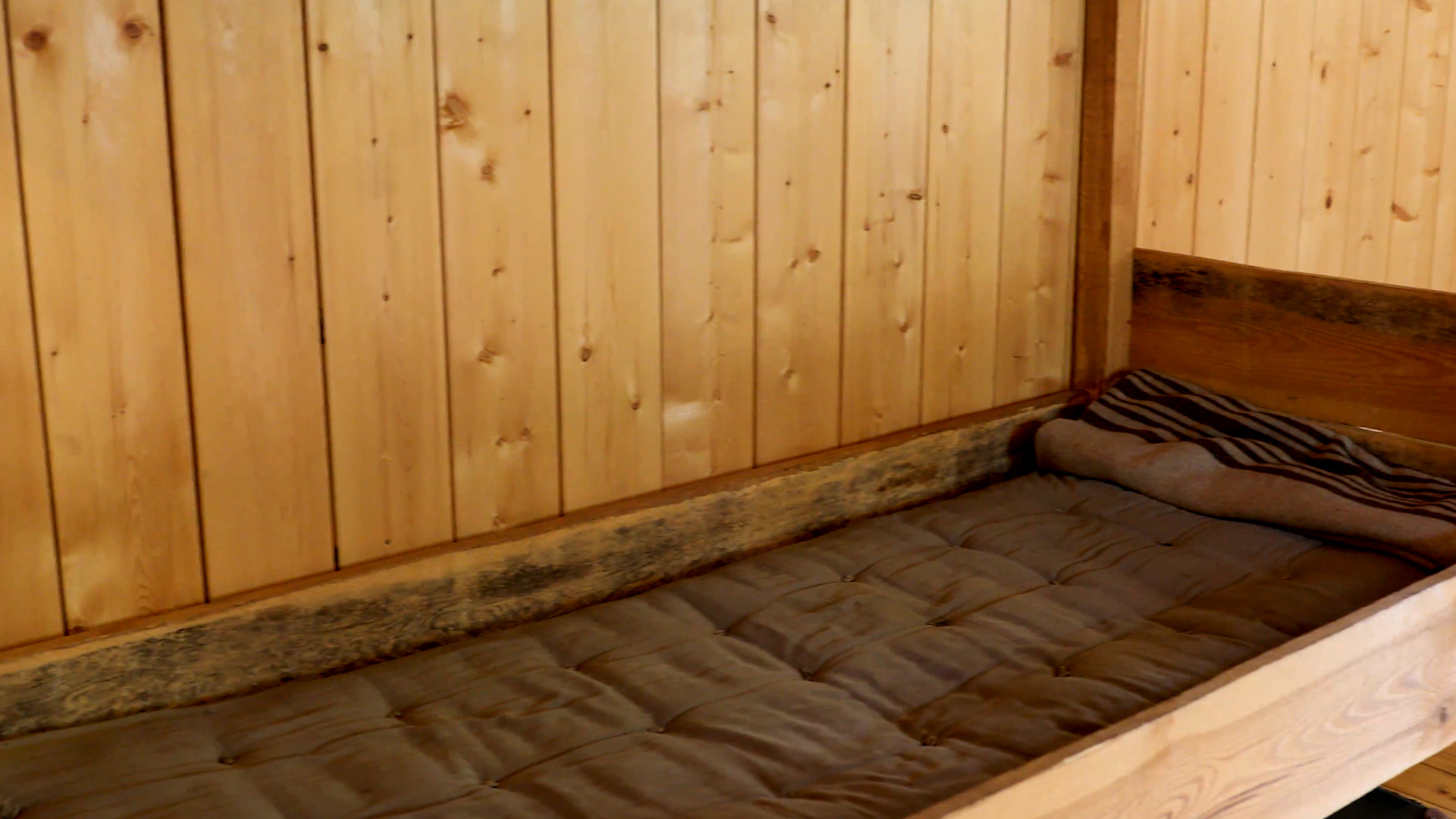 	A bed in the Stalag Luft 3 museum in Żagań, Poland on 5 July 2021 CREDIT US Army screengrab from footage
