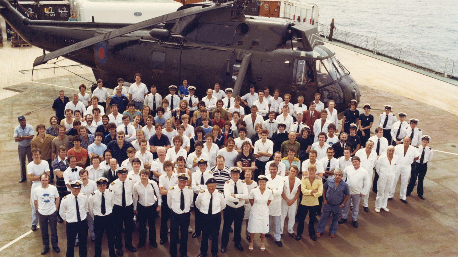 From the book 'An Ordinary Doctor: General Practice And Beyond' image shows SS Canberra's ship's company on the swimming pool turned flight deck CREDIT Dr Susie West