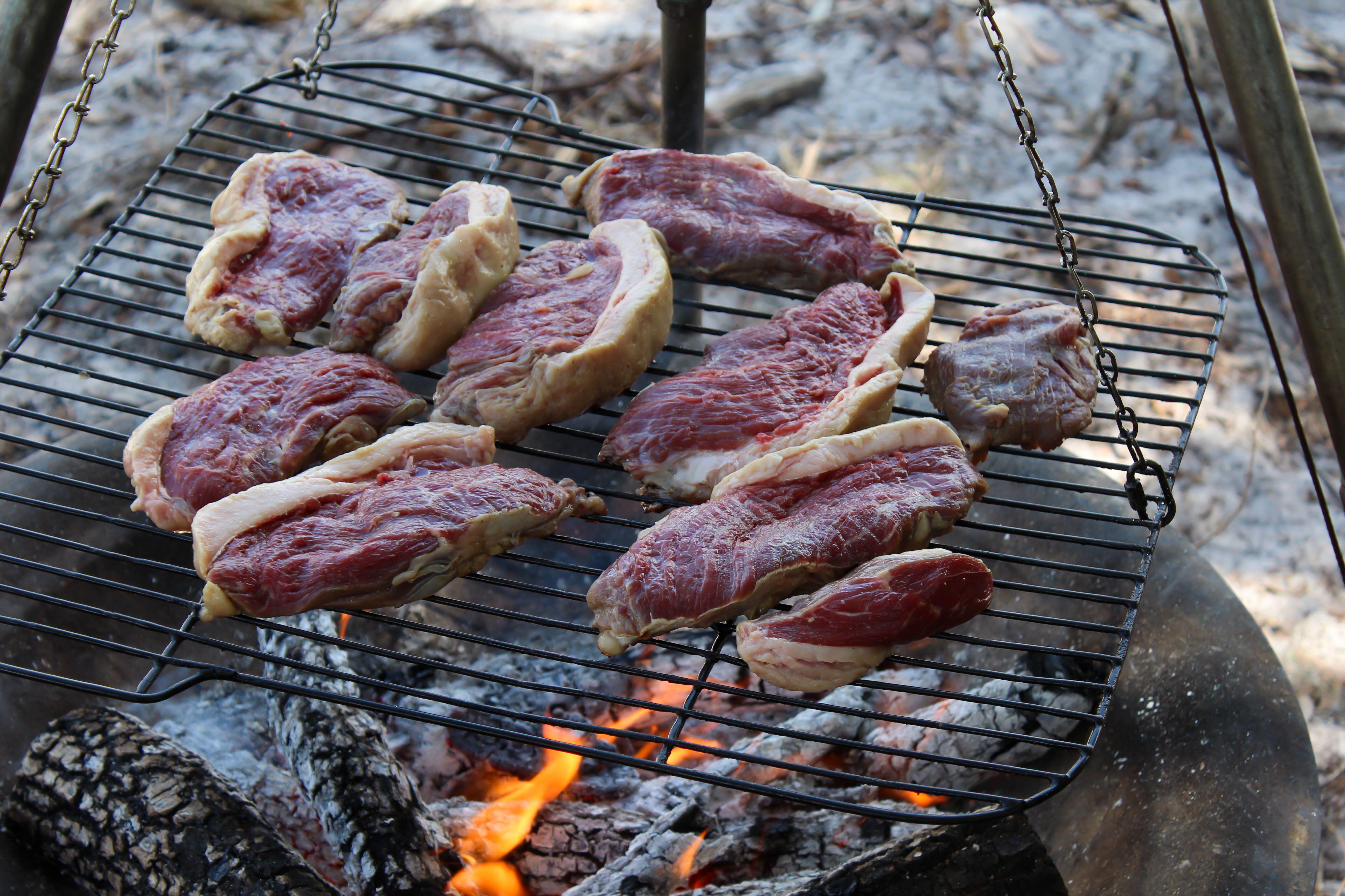Steaks on a barbecue. Picture: Alamy stock image