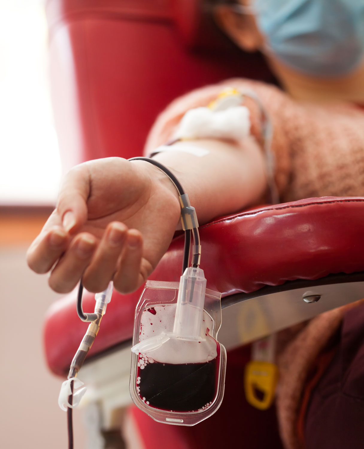 Woman donating blood during COVID-19 pandemic Credit: Shutterstock / Cryptographer