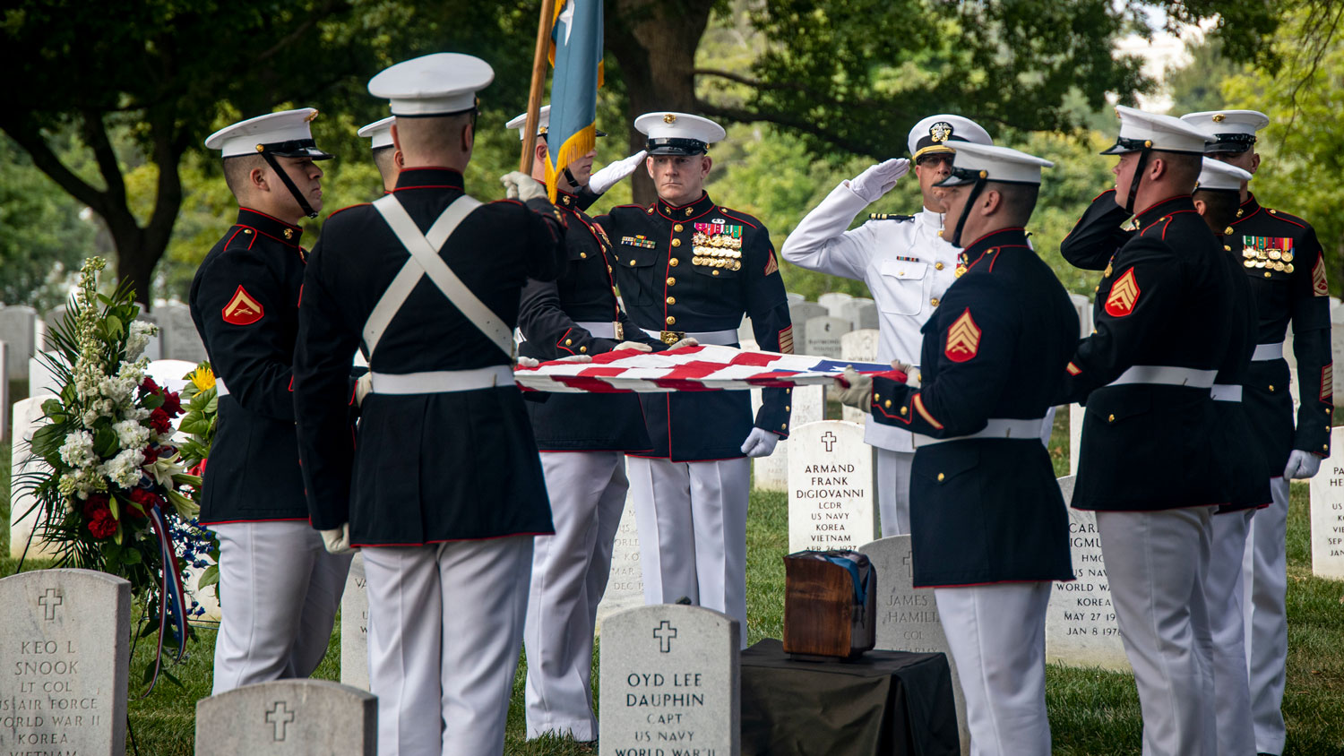 Body Bearers prepare to fold the US flag during a full honors funeral for Sgt Maj John L. Canley at Arlington National Cemetery on 25 August CREDIT US Marine Corps