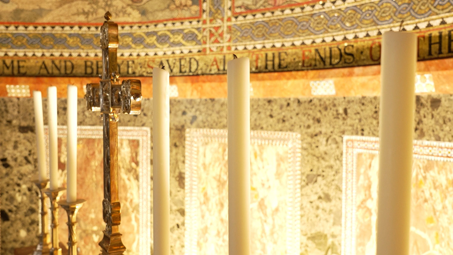 Candles and cross on high altar in the apse CREDIT BFBS