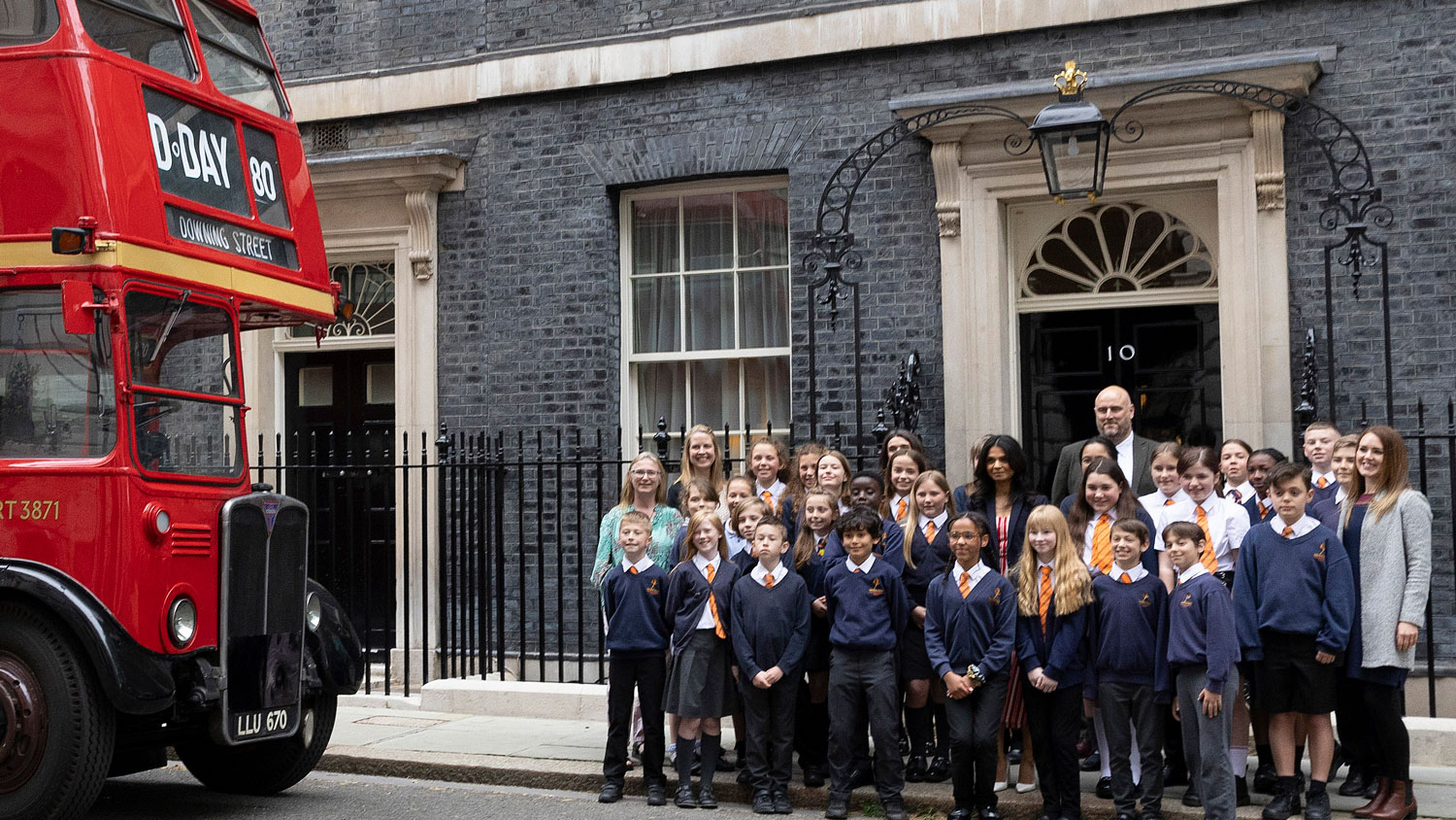 Children and teachers from Hayfield Cross Primary School are pictured outside No 10 Downing Street with Akshata Murty and the D-Day 80th bus in London on 21 May 2024 CREDIT Crown Copyright