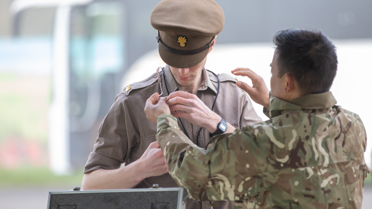 A member of the coronation parade having a device fitted to his uniform which will allow him to communicate (Picture: Corporal Mani Gurung).