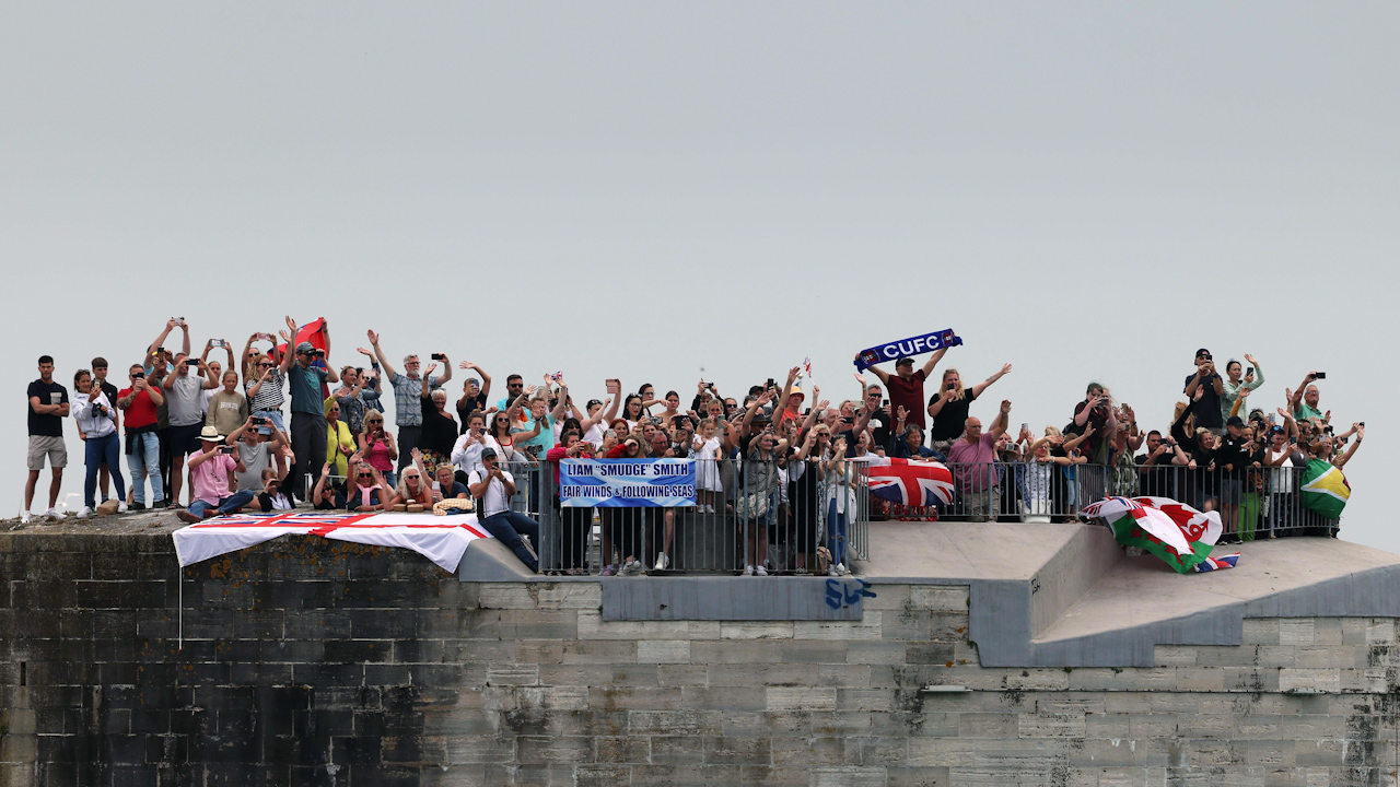 Families waving goodbye to the crew of HMS Duncan as they sail from Portsmouth (Picture: Royal Navy).