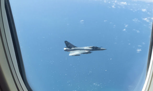 French Fighter Plane Shadows 'Terrified' Brits Flying Home