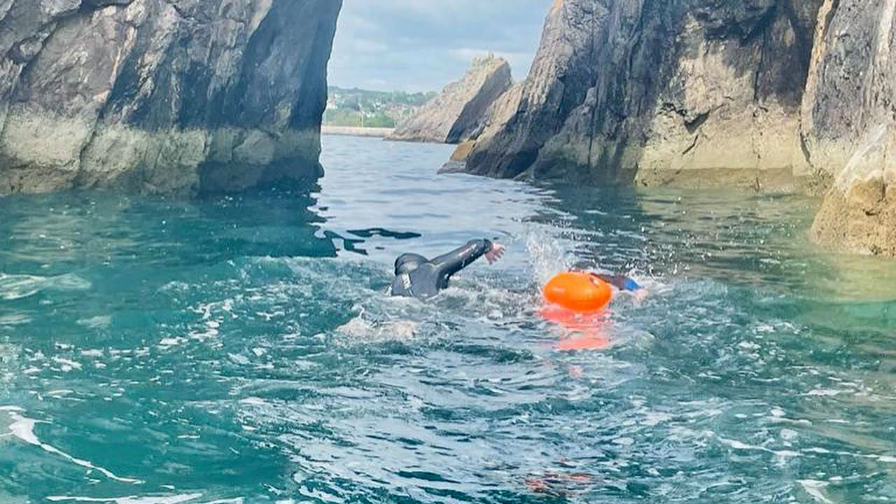 Former Royal Marine Commando Paul Wood has swum 325 miles since starting training in the Autumn, including through the Natural Arch in Torbay CREDIT WO2 (Retired) Paul Wood