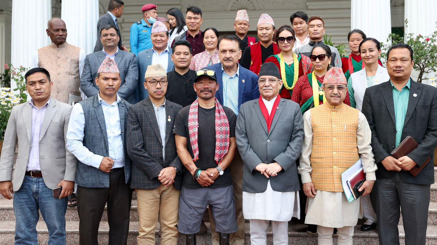 Gurkha veteran Hari Budha Magar in a group photo with the Prime Minister of Nepal, Deputy Prime Minister and Defence Minister, Finance Minister, Federal Affairs and General Administration Minister, Minister of Water Supply CREDIT PM Office