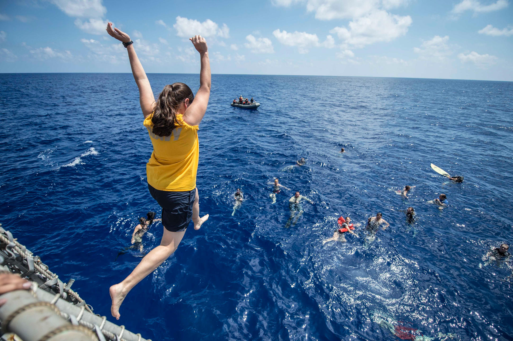 Yeoman 1st Class Margaret Royal from the USA, participates in a swim call aboard the USS Halsey. Picture: PJF Military Collection / Alamy  