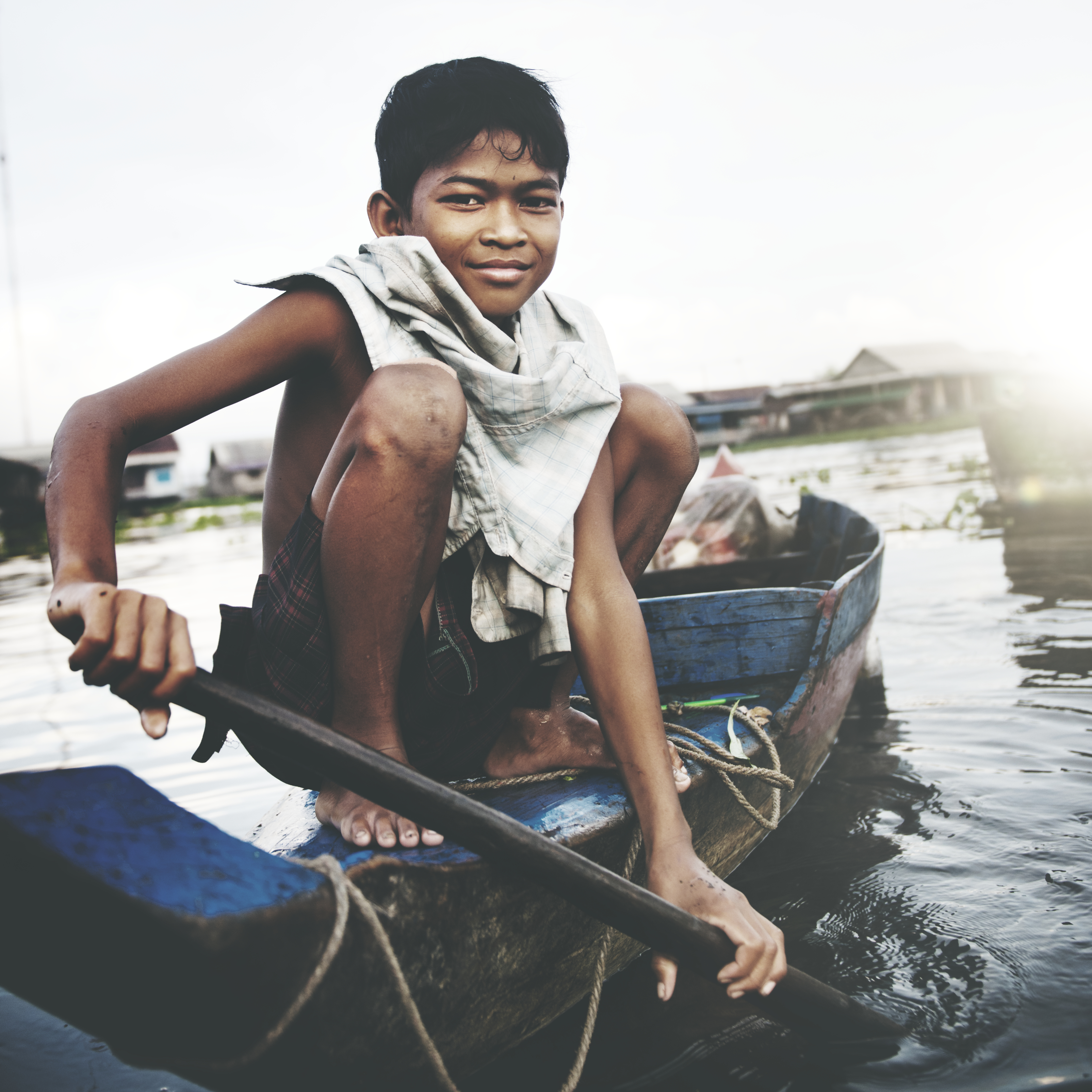 Cambodian boy on river. Rawpixel