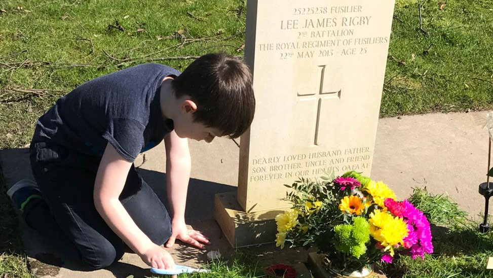Jack Rigby by his dad's grave in 2017 CREDIT Scotty's Little Soldiers