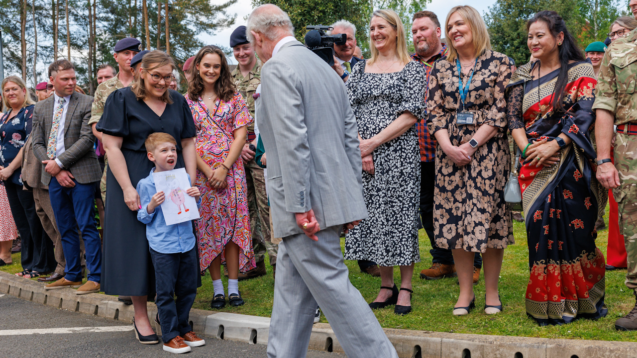 King Charles meeting Louis Bacon who shows him a picture of himself that he draw (Picture: PA).
