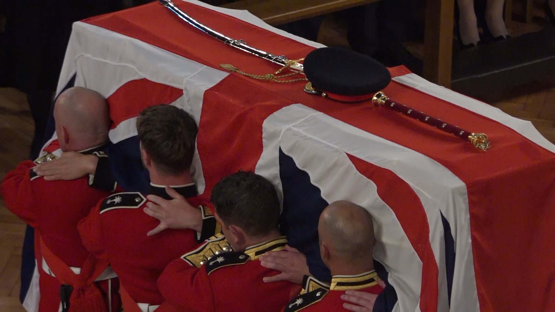 As the coffin was brought into the cathedral it was sprinkled with Holy Water